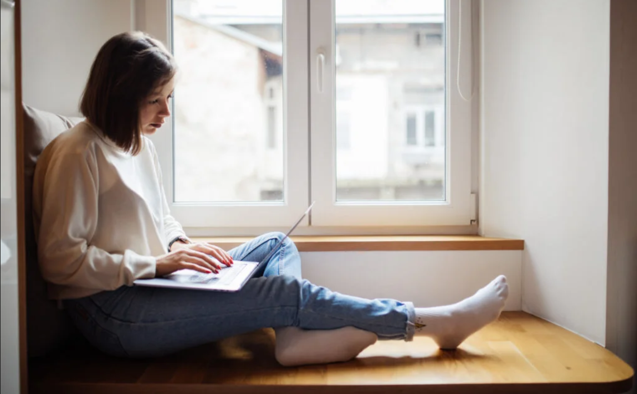 Student working on laptop at home
